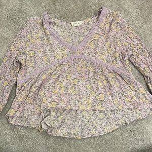 purple and yellow flowered shirt